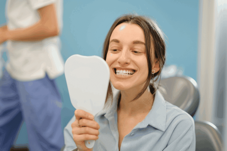 smiling patient after dental implant procedure