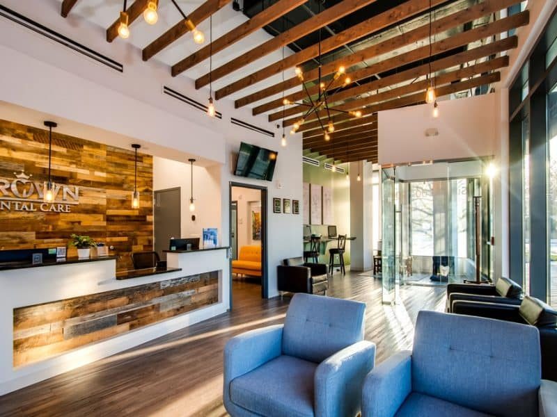 Patient operatory with flat-screen TV and modern dental chair, Crown Dental Care